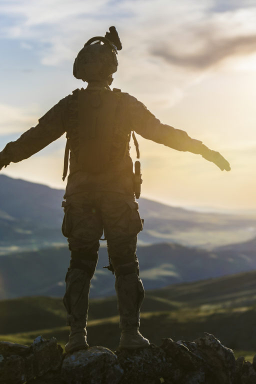 Silhouette of soldier against sunset